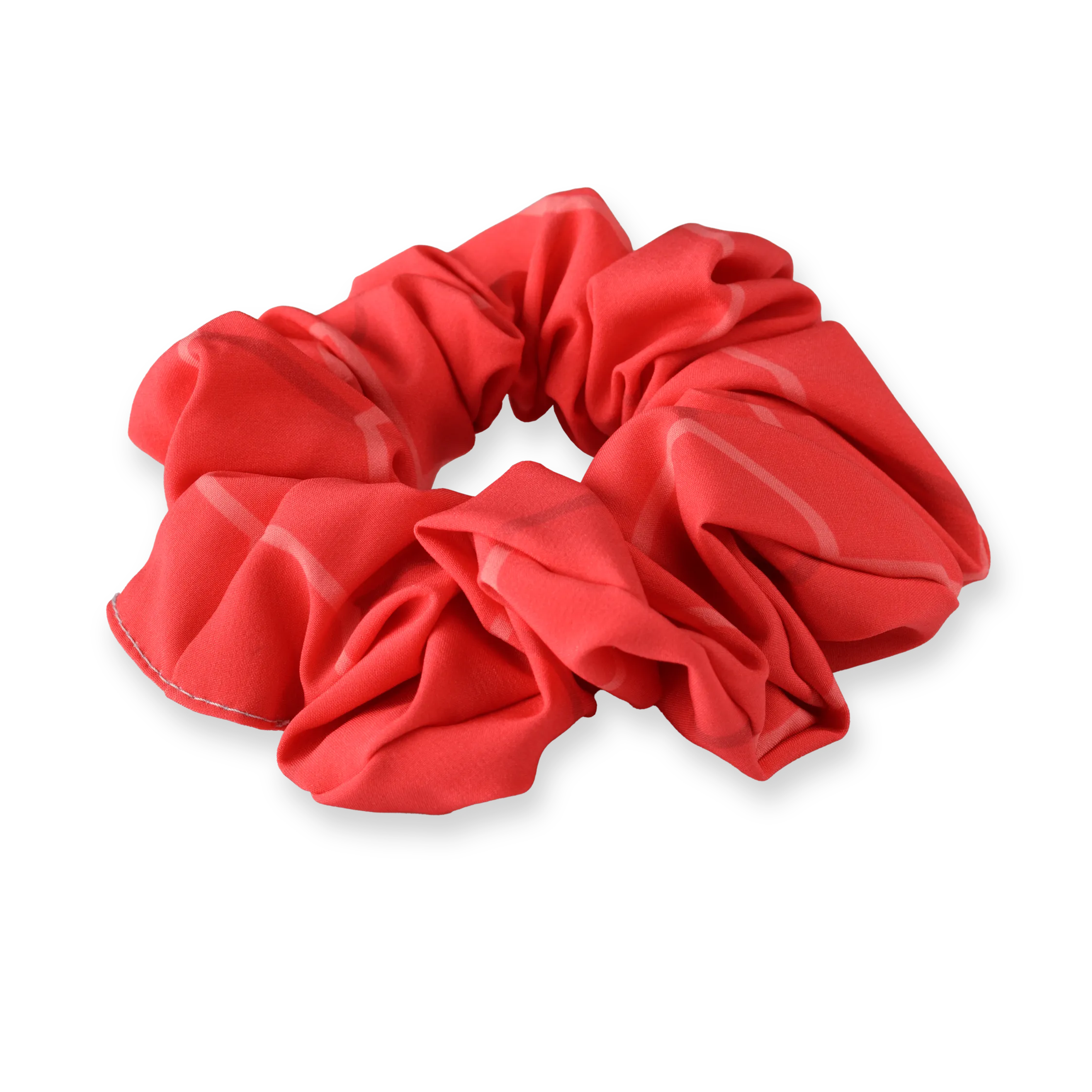 Ein rotes Scrunchie aus weichem Material mit einem lässigen Design.
