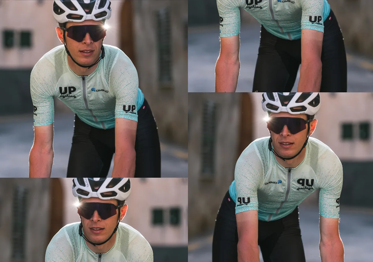 Ein Radfahrer in einem hellblauen, gemusterten Trikot mit dem Logo 'UP cycling' und dem Markennamen 'owayo' auf der Brust, der auf einem Fahrrad fährt.